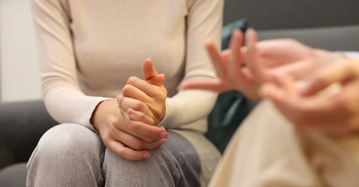 Close-up of hands during a counselling session