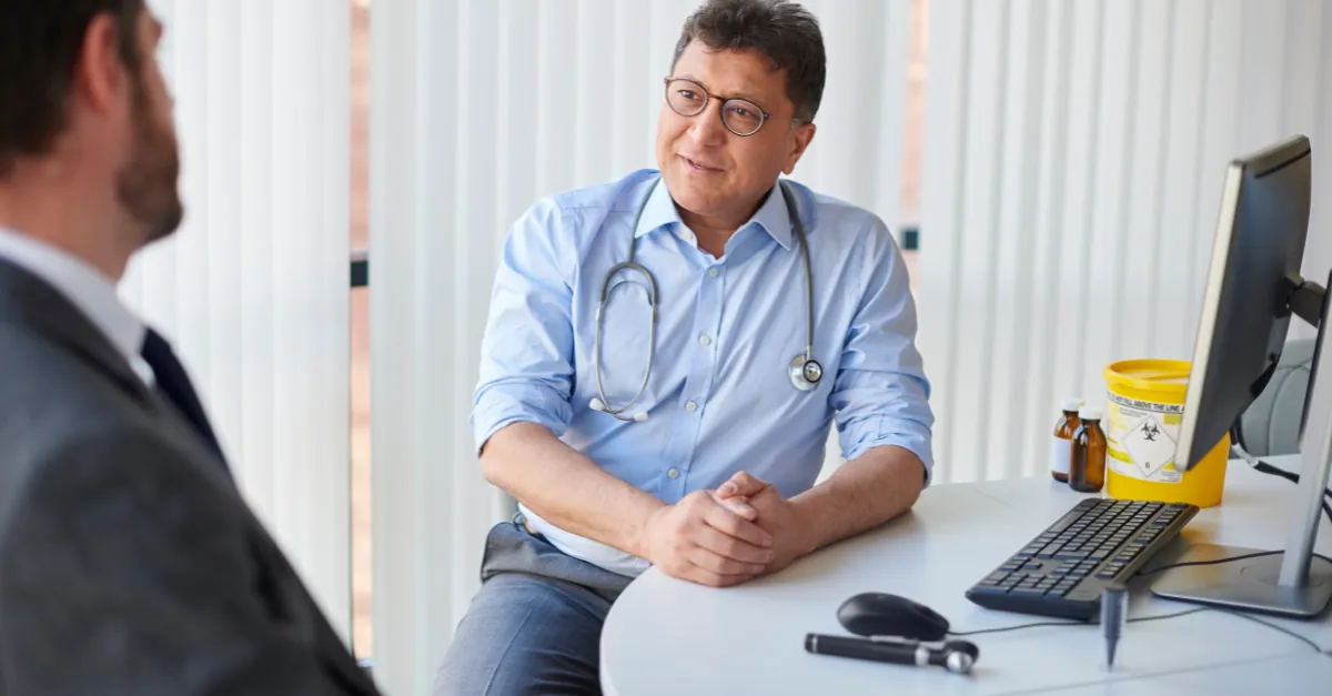 Doctor consulting with a patient in a private room